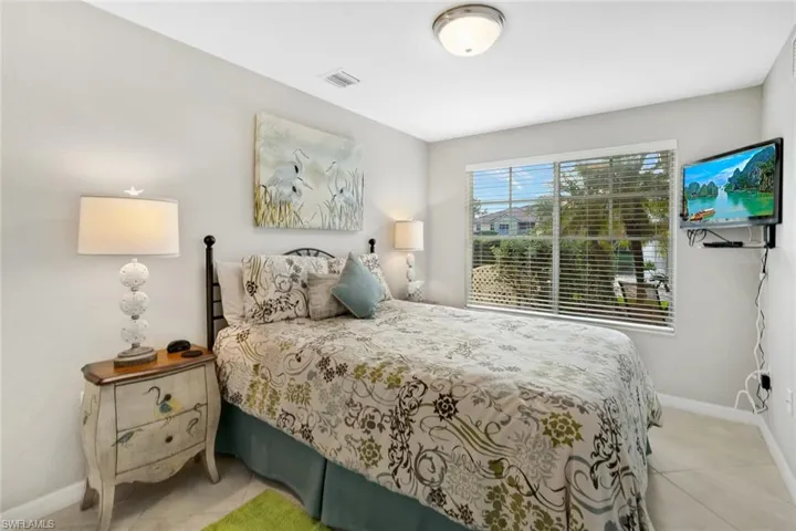 Tiled bedroom with baseboards