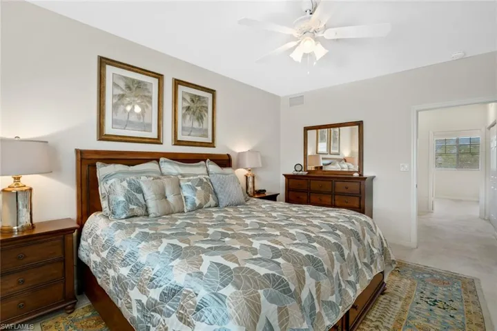 Bedroom with a ceiling fan and baseboards