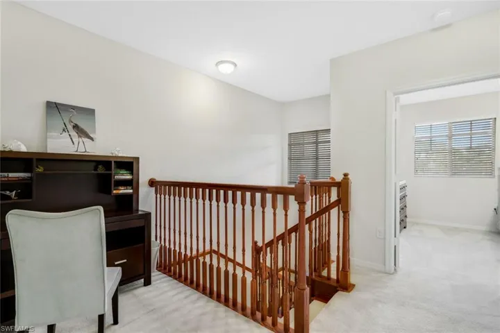 Office featuring carpet flooring, plenty of natural light, and baseboards