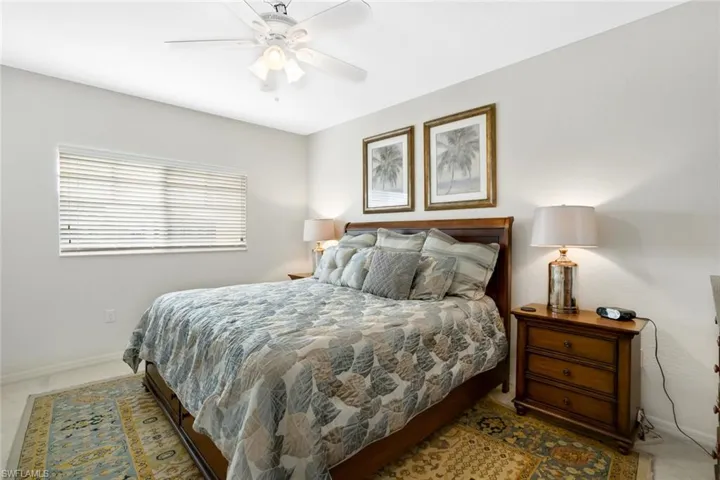 Bedroom featuring baseboards and ceiling fan