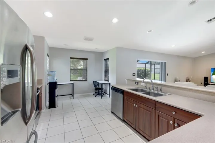 Kitchen featuring appliances with stainless steel finishes, recessed lighting, light countertops, and light tile patterned floors