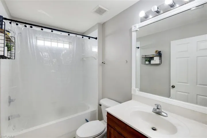 Bathroom with vanity and shower / bathtub combination