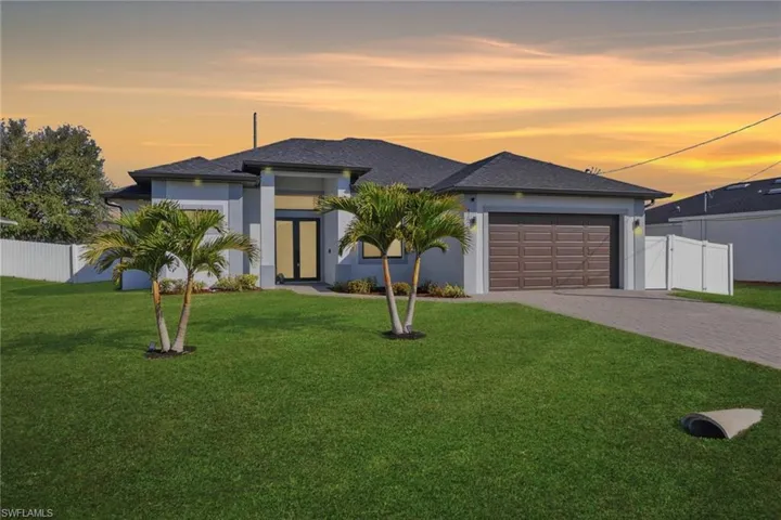 Prairie-style home with an attached garage, decorative driveway, stucco siding, and a shingled roof