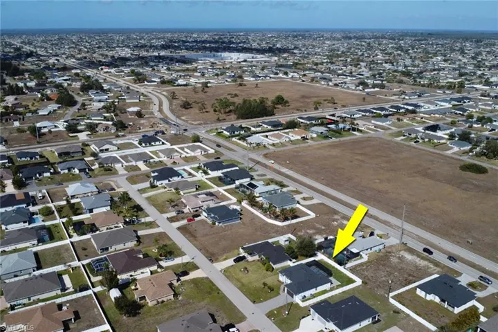 View of property location with nearby suburban area