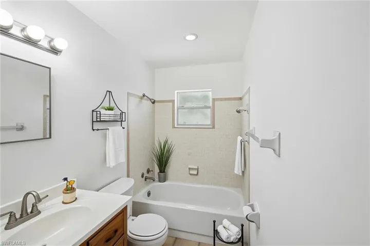 Full bath featuring vanity, toilet, and tub / shower combination