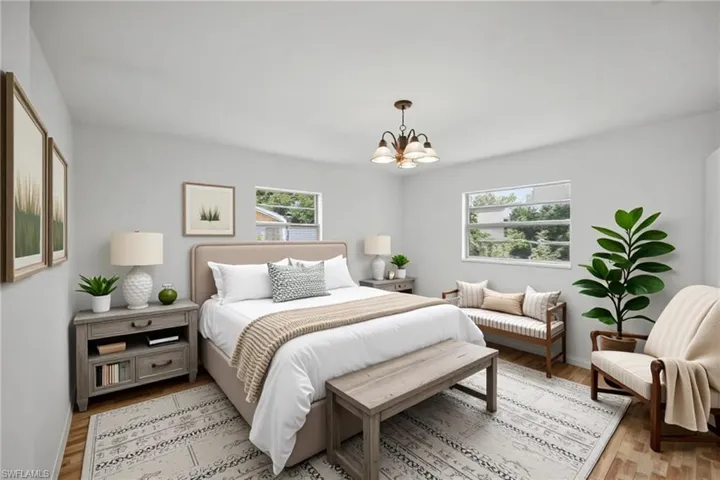 Bedroom with a chandelier, tile flooring, a closet and ensuite bathroom