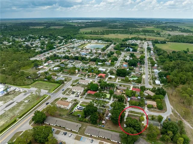Aerial overview of property's location with nearby suburban area