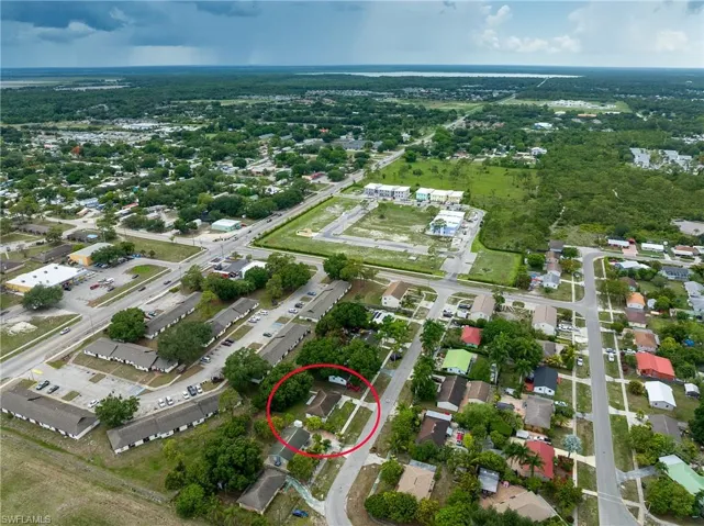 Aerial view of property's location featuring nearby suburban area