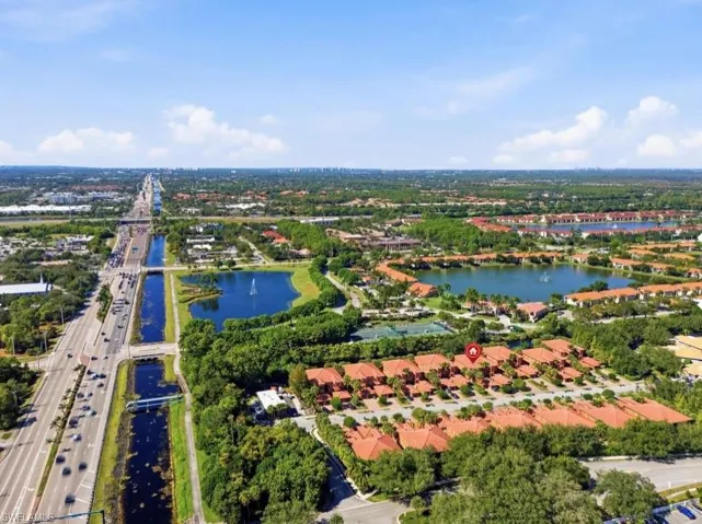 Aerial view of property's location with a large body of water and a highway