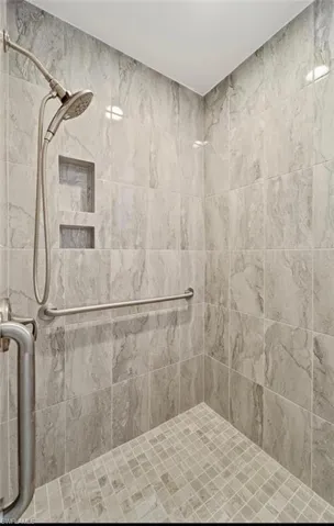Bathroom featuring a tile shower