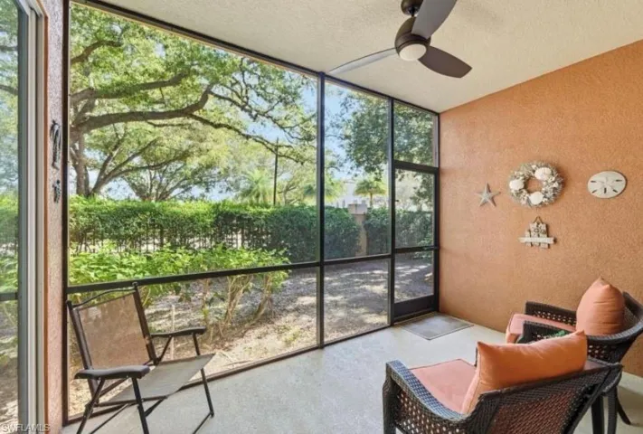 Sunroom featuring a ceiling fan