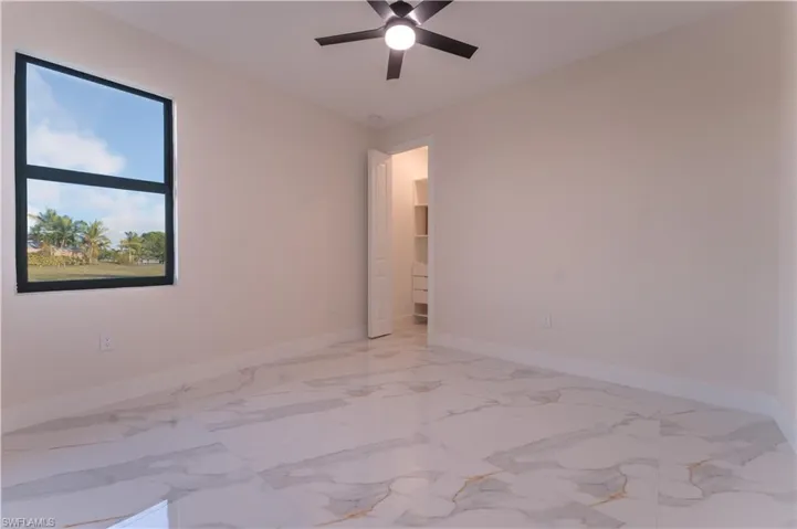 Empty room featuring ceiling fan