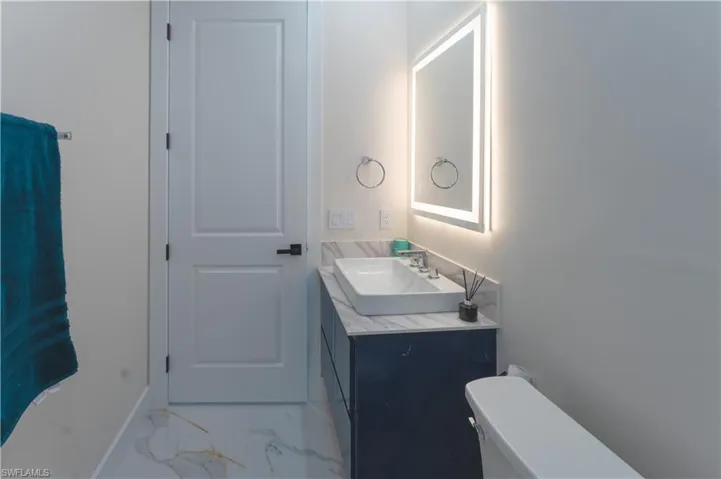 Bathroom with vanity and toilet