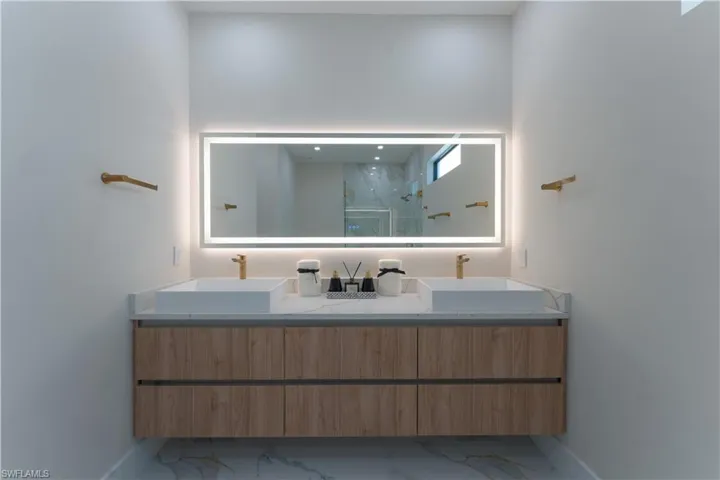 Bathroom featuring vanity and walk in shower