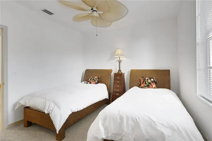 Bedroom with carpet flooring and ceiling fan