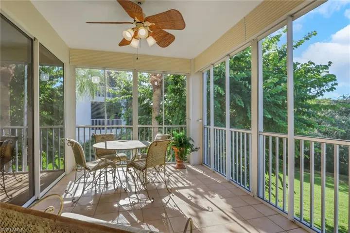 Sunroom / solarium with a ceiling fan and plenty of natural light
