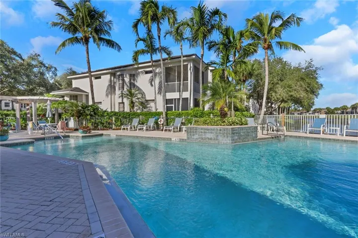 Community pool featuring a patio