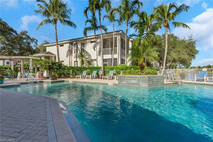 Community pool featuring a patio