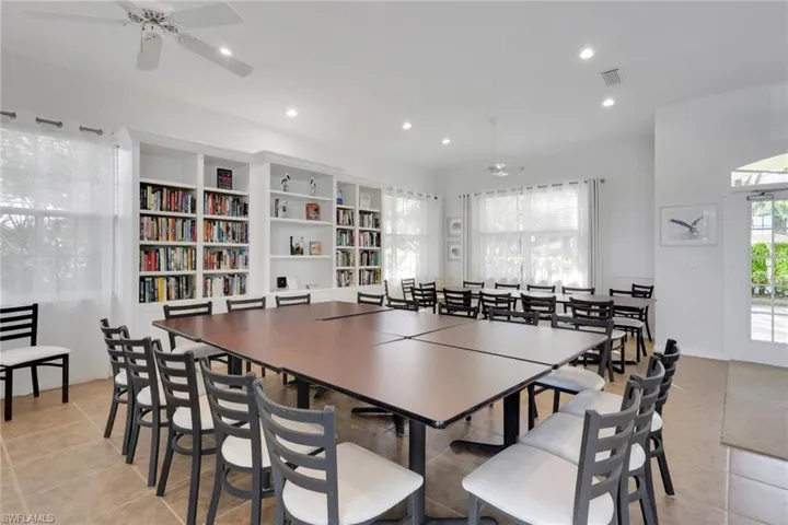 Dining area with ceiling fan, light tile patterned flooring, and recessed lighting