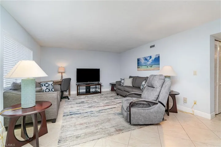 Living area featuring light tile patterned floors