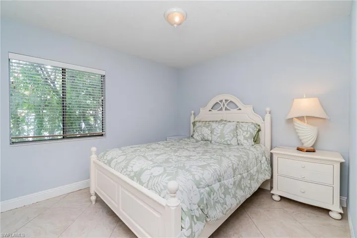 Bedroom with light tile patterned floors
