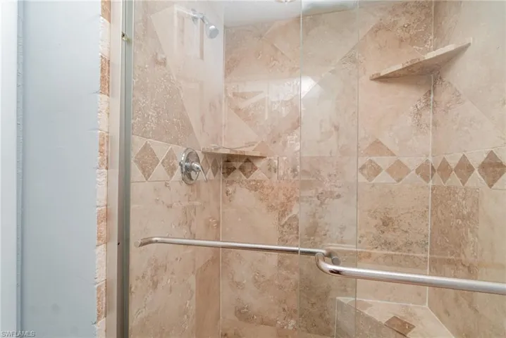 Full bathroom featuring a stall shower