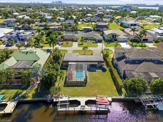 Aerial perspective of suburban area with a large body of water