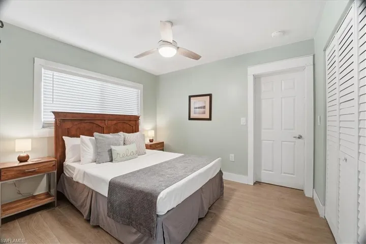 Bedroom with light wood-type flooring and ceiling fan