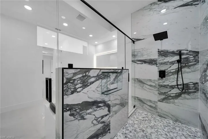 Bathroom featuring a shower with shower door