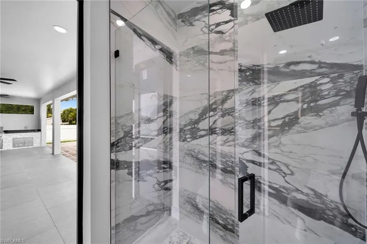Bathroom featuring a tile shower and tile patterned floors