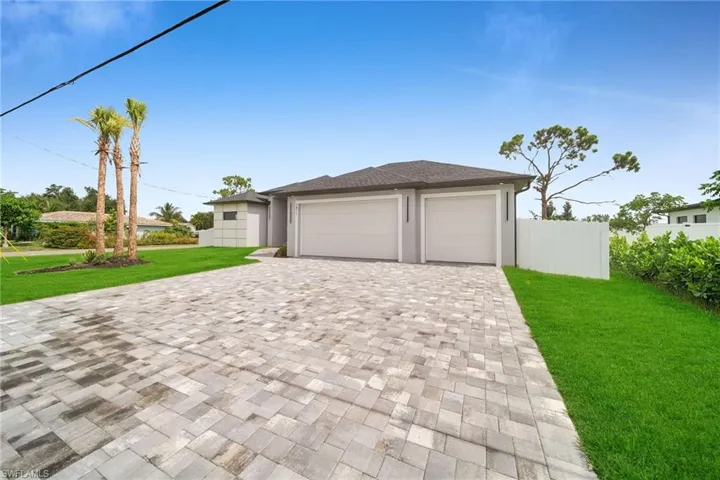 Garage featuring a yard