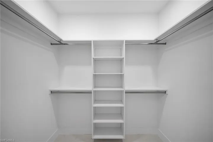 Spacious closet featuring tile patterned flooring