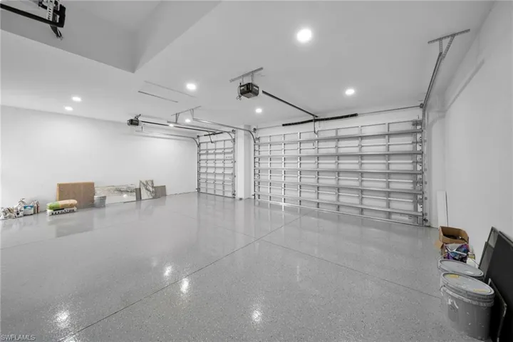 Garage featuring a garage door opener
