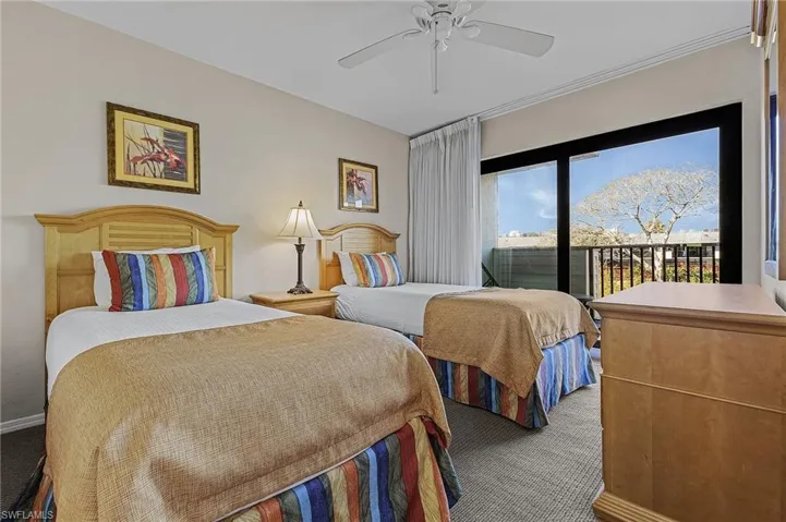 Bedroom featuring carpet, access to exterior, and ceiling fan