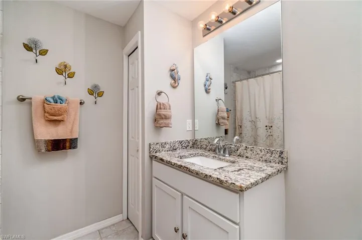 Guest bathroom with a linen closet.