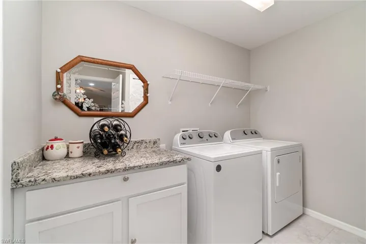 Large laundry room with closet and storage area beyond the photo.