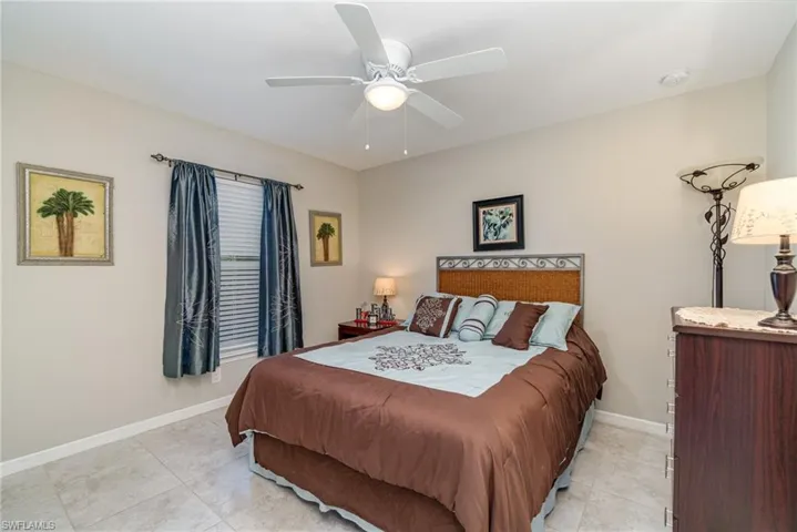 Guest bedroom with a window over looking the back yard.