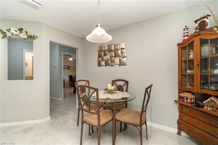 Dining area with a window over looking the lanai.