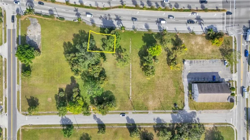 Aerial view of property and surrounding area with property boundaries highlighted