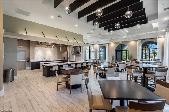 Dining room featuring light wood finished floors, beamed ceiling, recessed lighting, and baseboards