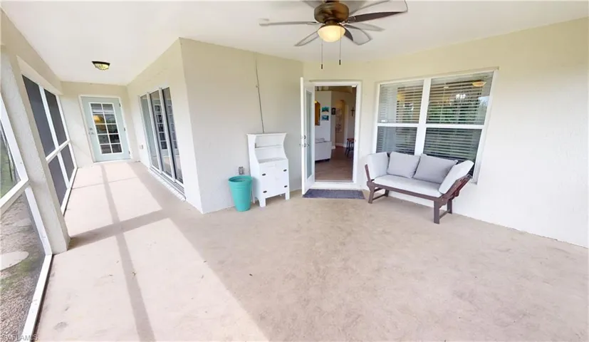 View of patio featuring ceiling fan