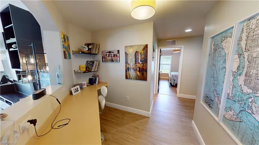 Home office featuring hardwood / wood-style floors