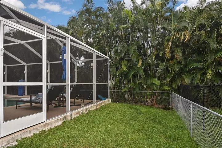View of yard with a lanai