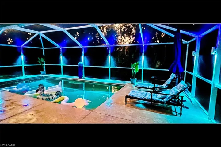 View of swimming pool with glass enclosure