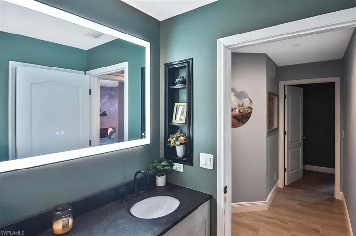 Bathroom featuring vanity and tile / wood-style flooring