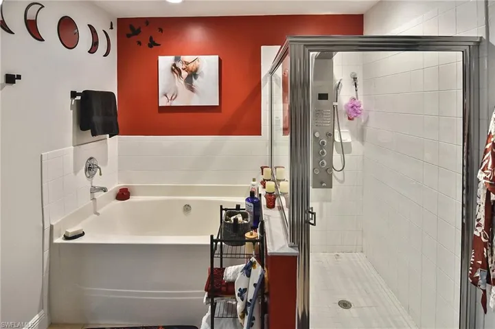 Bathroom featuring plus walk in shower