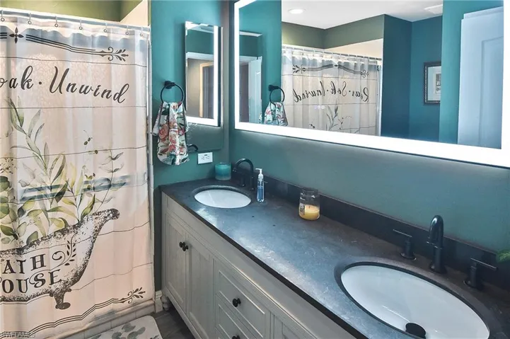 Bathroom featuring double vanity