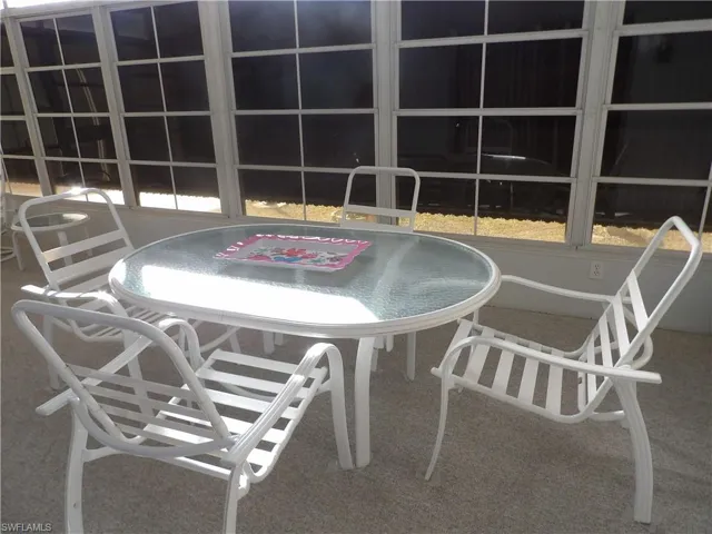 View of patio with outdoor dining area