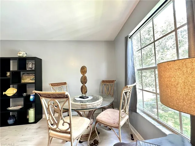 Dining space with hardwood / wood-style floors