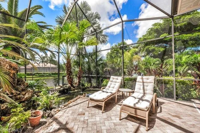 Unfurnished sunroom with a water view